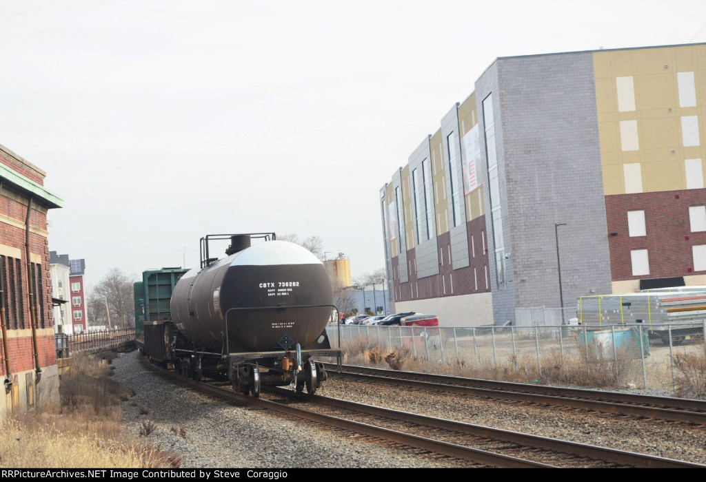 CBTX 736282 passing Old CNJ Station and Self Storage Building